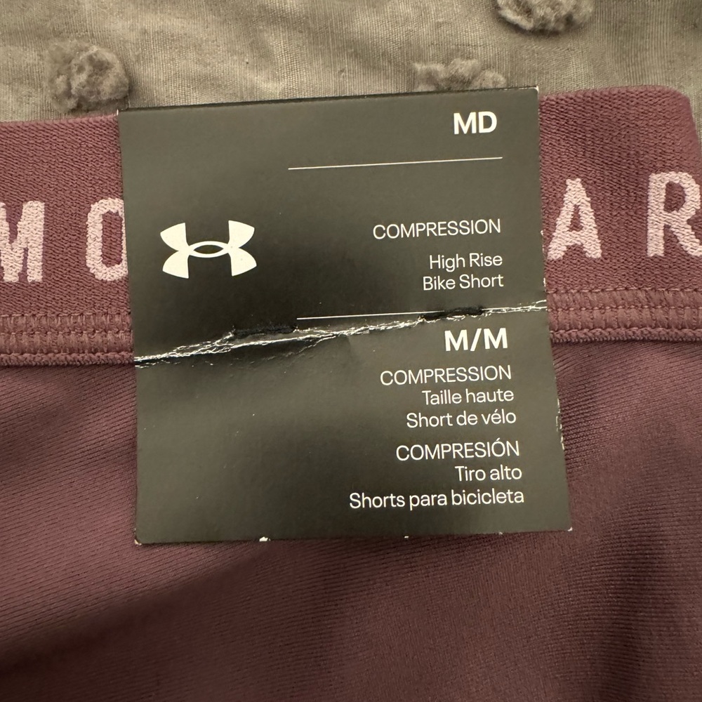 Women's Underarmour shorts, size M, purple.